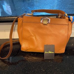 Sam Edelman brown tote with crossbody strap.